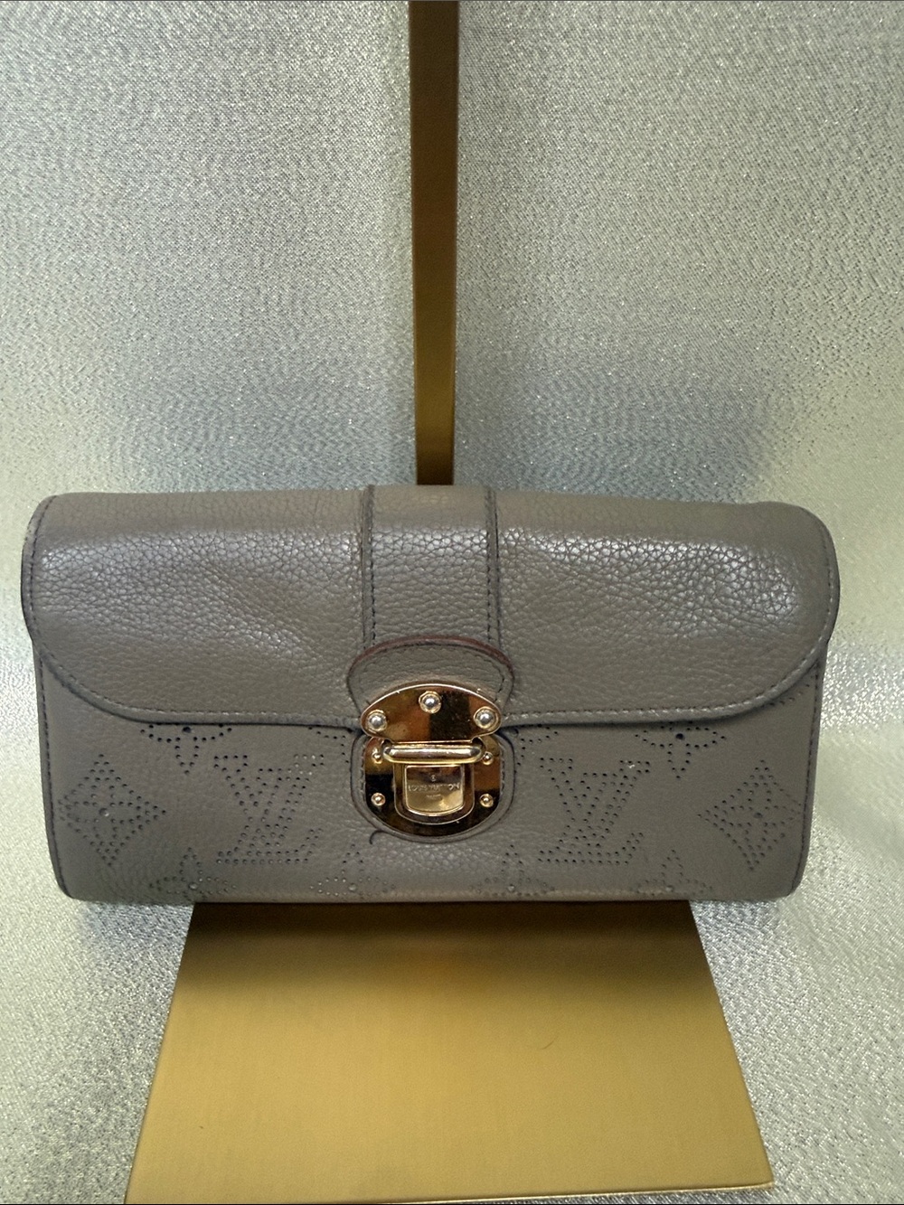 Louis Vuitton Gray Pebbled Mahina Leather with Gold Tone Push Lock